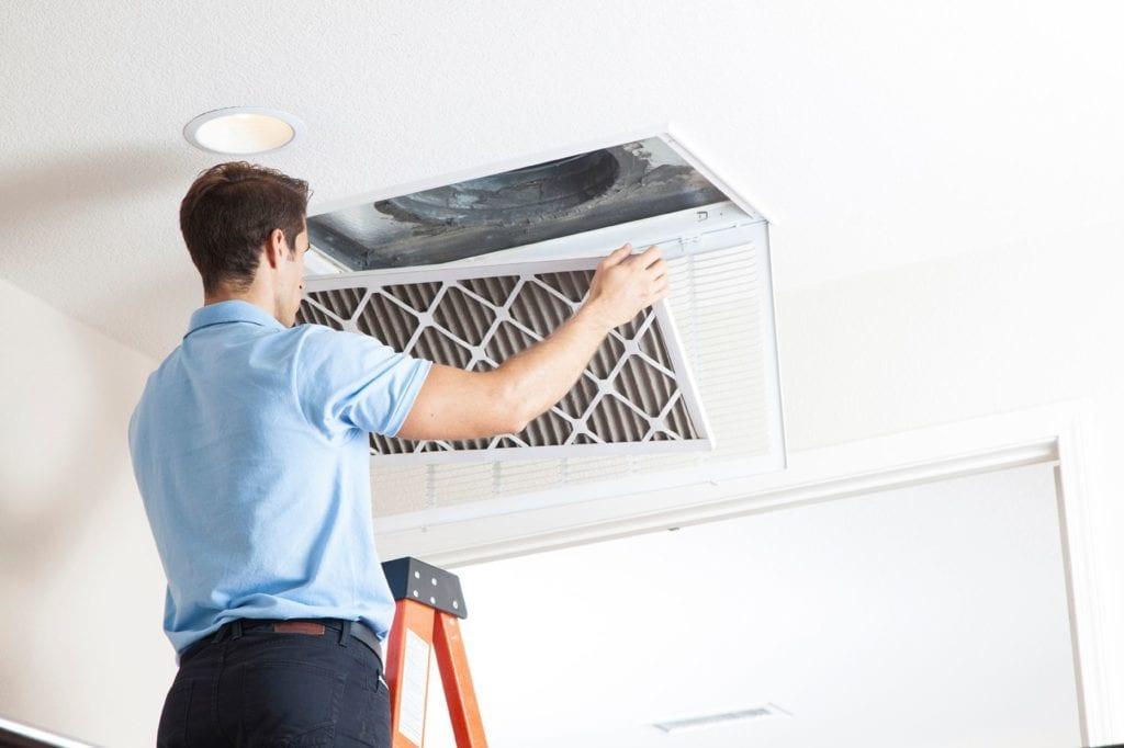 man changing filters