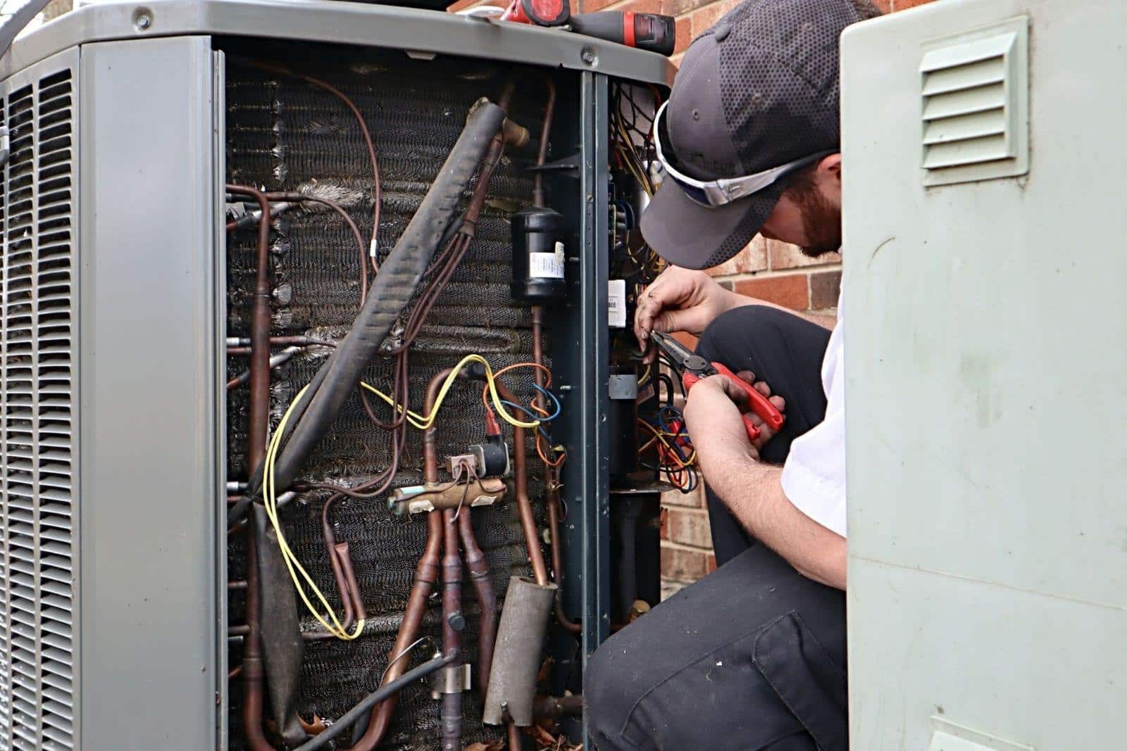 Technician working on an air conditioner.