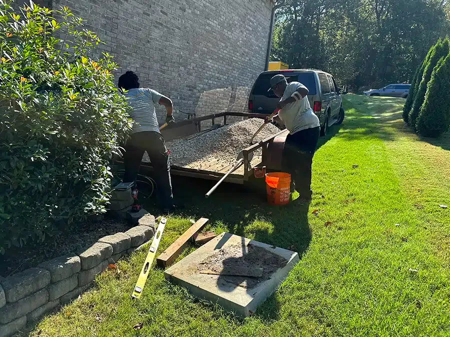 Xcalibur Services technicians conducting AC installation outside of home in Birmingham, AL