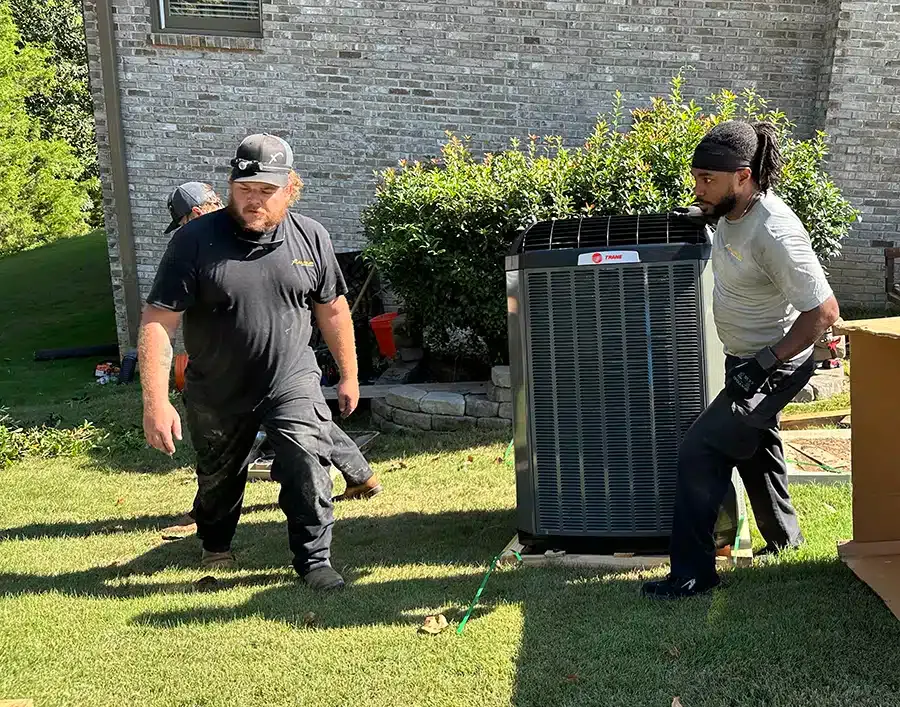 Xcalibur Services technicians conducting heating repairs in birmingham outside of home in Birmingham, AL